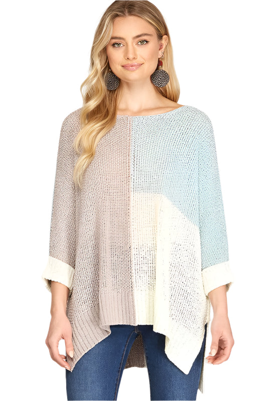 "Grå och himmelsblå stickad pullover för kvinnor med modern färgblockdesign och lös passform för stil och komfort."