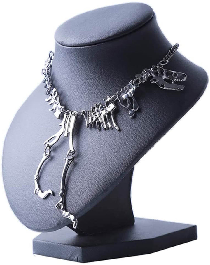 "Halsband med detaljerat T-Rex-skelett, rörlig design i brons och guld. Perfekt för damer som älskar dinosaurier."