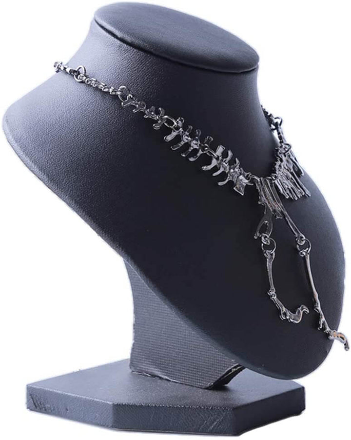 "Halsband med detaljerat T-Rex-skelett, rörlig design i brons och guld. Perfekt för damer som älskar dinosaurier."