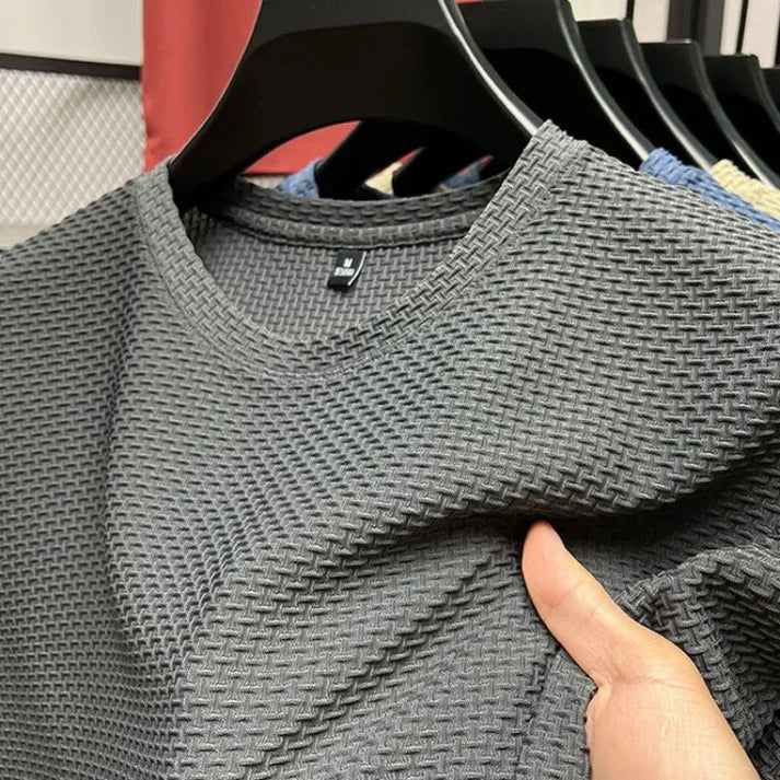"Herr T-shirt kortärmad i andningsbart material för träning, grå färg, optimal ventilation och bekväm passform."