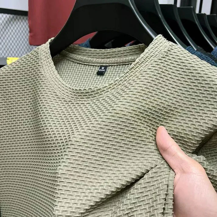 "Herr T-shirt kortärmad i andningsbart material för träning, grå färg, optimal ventilation och bekväm passform."
