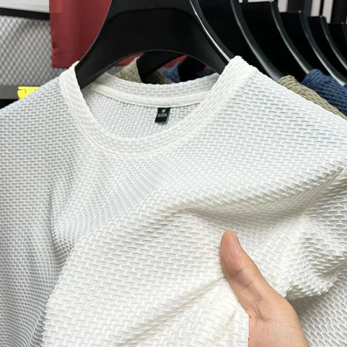 "Herr T-shirt kortärmad i andningsbart material för träning, grå färg, optimal ventilation och bekväm passform."