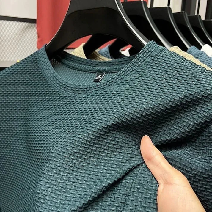 "Herr T-shirt kortärmad i andningsbart material för träning, grå färg, optimal ventilation och bekväm passform."