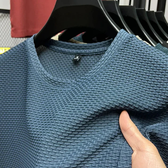 "Herr T-shirt kortärmad i andningsbart material för träning, grå färg, optimal ventilation och bekväm passform."