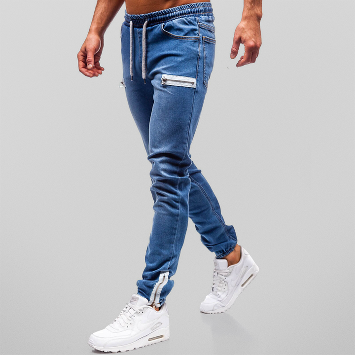 "Herr denim joggingbyxor med mjuk bomull, hög midja och dekorativa blixtlåsstängningar för stil och komfort."