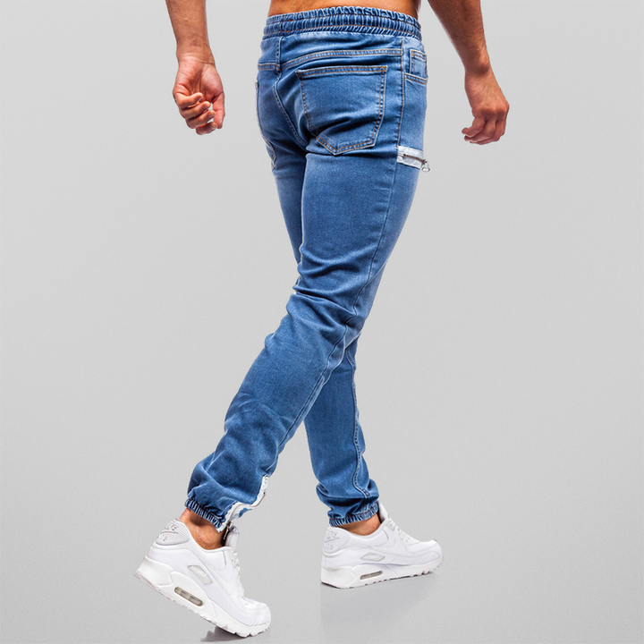 "Herr denim joggingbyxor med mjuk bomull, hög midja och dekorativa blixtlåsstängningar för stil och komfort."
