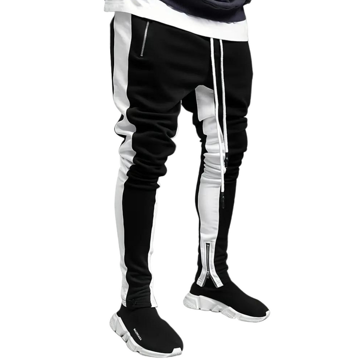 "Herr joggingbyxor i modernt snitt, elastisk midja, slimmad passform, sidofickor, lätt tyg, perfekt för gym och fritid."