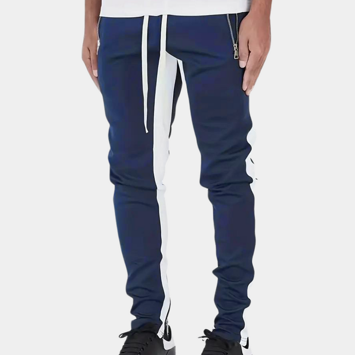 "Herr joggingbyxor i modernt snitt, elastisk midja, slimmad passform, sidofickor, lätt tyg, perfekt för gym och fritid."