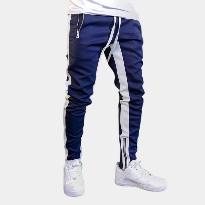 "Herr joggingbyxor i modernt snitt, elastisk midja, slimmad passform, sidofickor, lätt tyg, perfekt för gym och fritid."