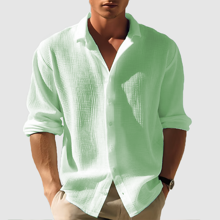 Herr långärmad button-down skjorta i enkel design, bekväm passform, tidlös stil. Perfekt för både vardag och arbete.