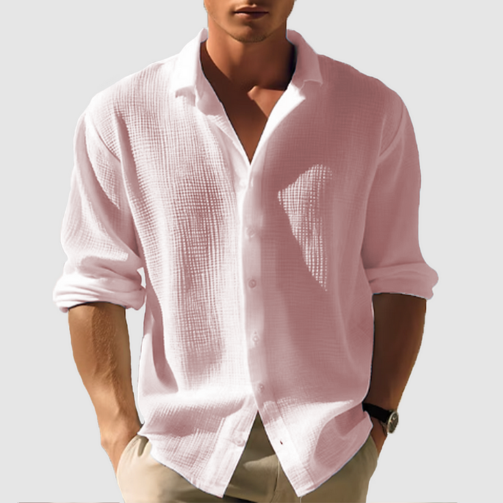 Herr långärmad button-down skjorta i enkel design, bekväm passform, tidlös stil. Perfekt för både vardag och arbete.