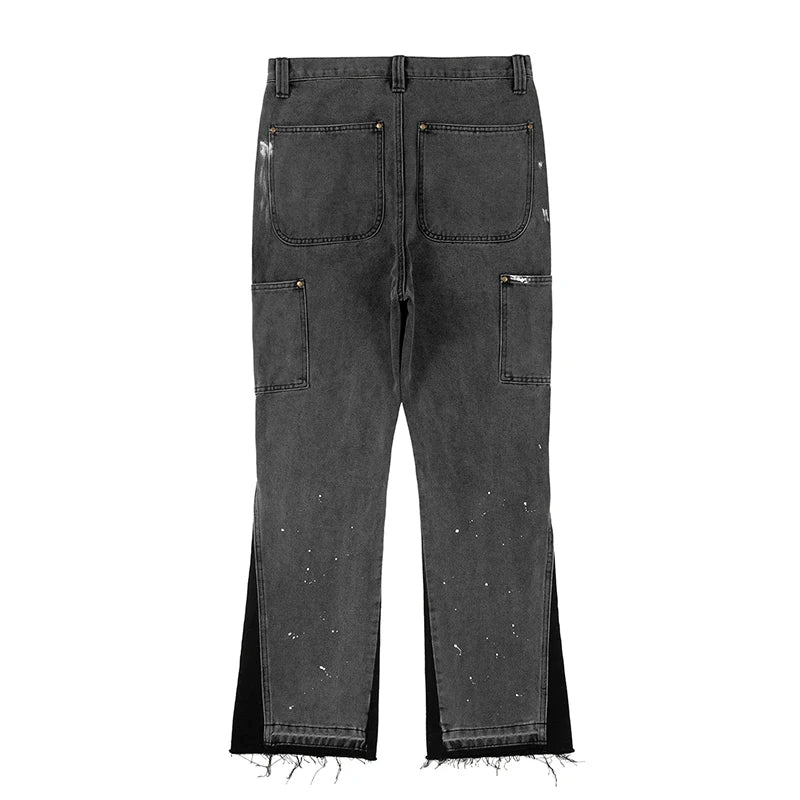 "Herr retro streetwear denim byxor med fläckig bläckfärg och baggy passform, konstnärligt mönster för unik stil"