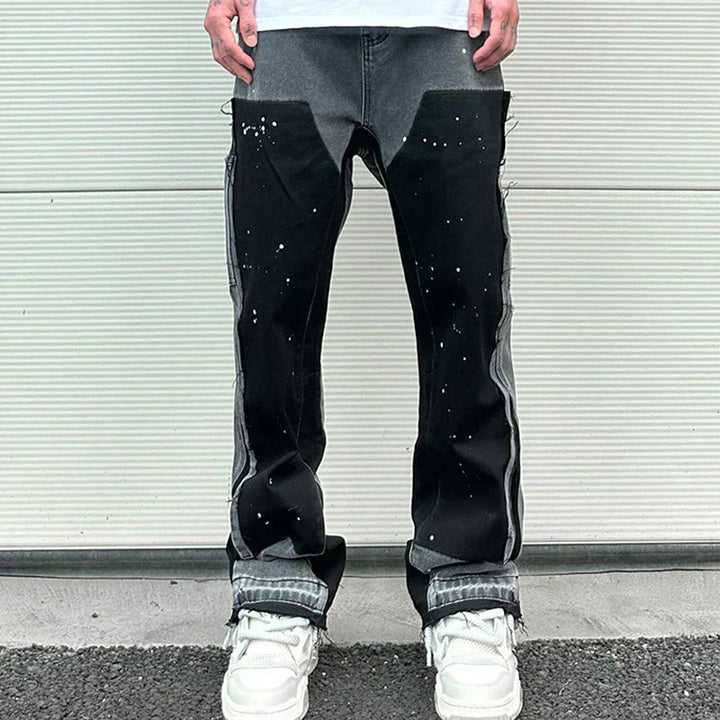 "Herr retro streetwear denim byxor med fläckig bläckfärg och baggy passform, konstnärligt mönster för unik stil"