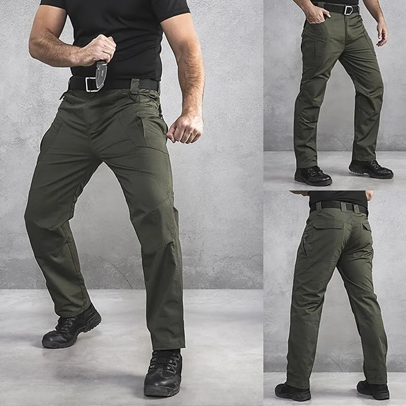 "Herr taktiska lastbyxor i polyester med flera fickor, idealiska för friluftsliv, grön färg och robust design."