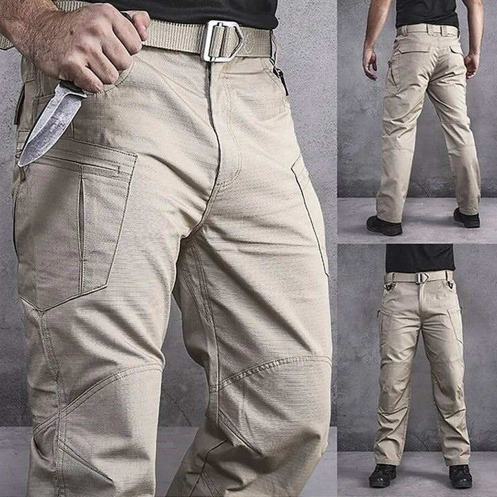 "Herr taktiska lastbyxor i polyester med flera fickor, idealiska för friluftsliv, grön färg och robust design."
