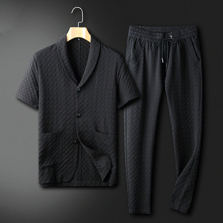 "Herr tvådelad kostym i svart med geometriskt mönster, bekväm polyester, elegant och trendig för sommarevenemang."