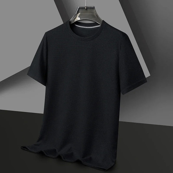 "Herr våfflad bomullst-shirt med rund hals, grön, unikt texturerat tyg, andningsbart och stilfullt, perfekt vardagsplagg."