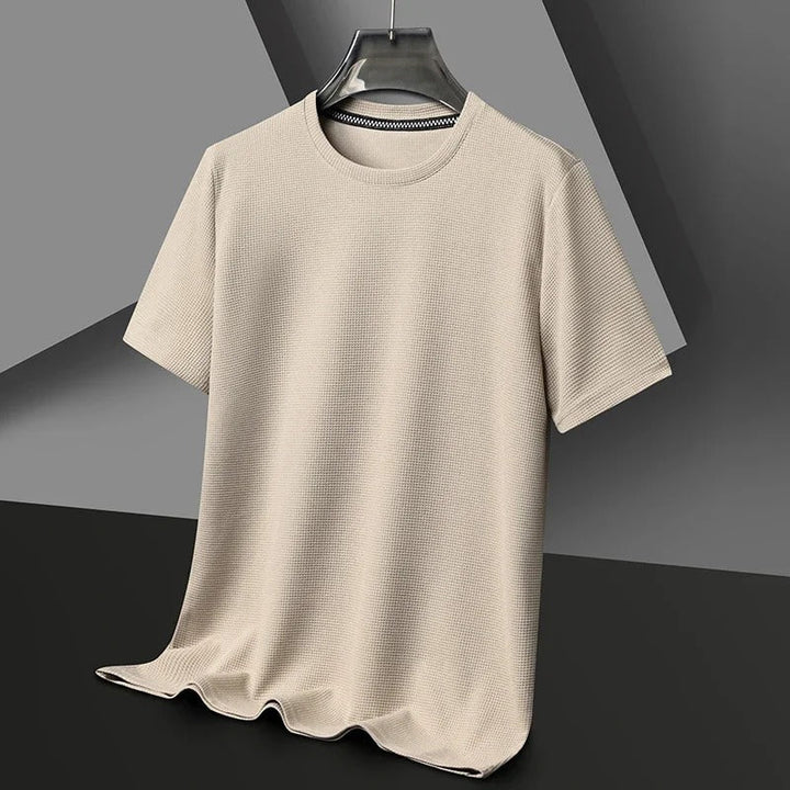 "Herr våfflad bomullst-shirt med rund hals, grön, unikt texturerat tyg, andningsbart och stilfullt, perfekt vardagsplagg."