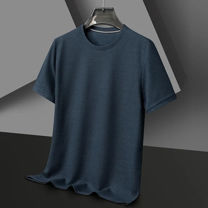 "Herr våfflad bomullst-shirt med rund hals, grön, unikt texturerat tyg, andningsbart och stilfullt, perfekt vardagsplagg."