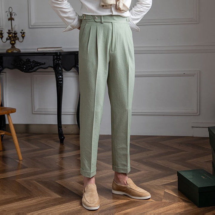 "Herr vintage byxor hög midja, raka ben, framsida i beige och blå nyans, stilren och tidlös design."