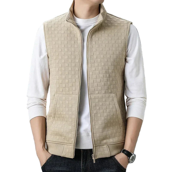 Herrar zip väst med rutnät design, funktionella fickor, perfekt för aktiv livsstil. Stilren zip-up för enkel användning.