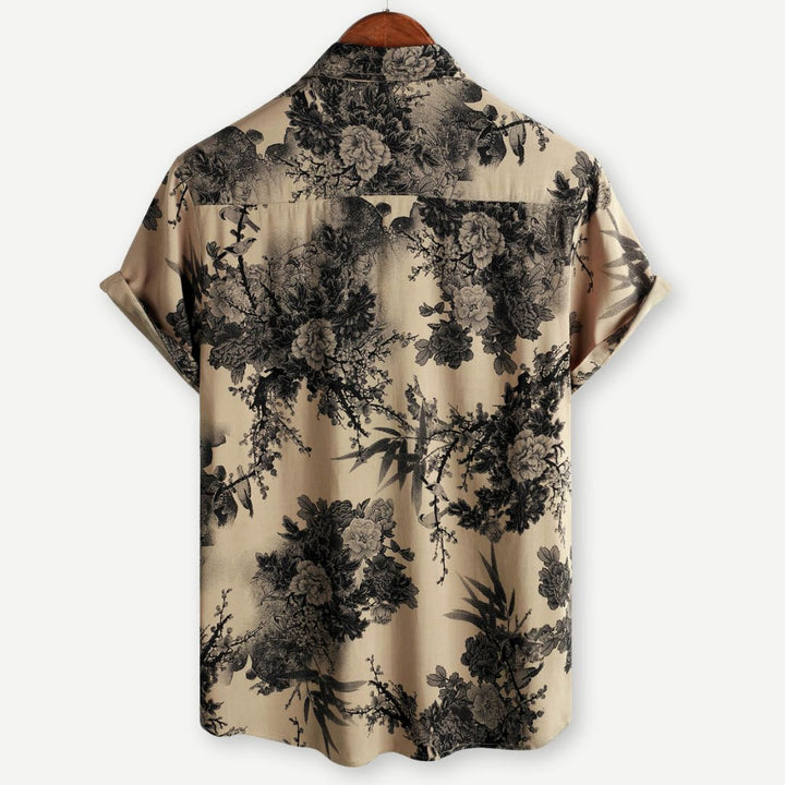 "Herrblom T-shirt med korta ärmar, blommigt mönster, lätt och stretchigt tyg, idealisk för vardag och avkoppling."