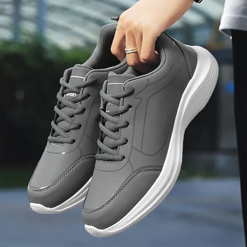 Herrens vinter andningsbara sneakers i syntetiskt material, eleganta med anti-glid sula, perfekta för kalla dagar.