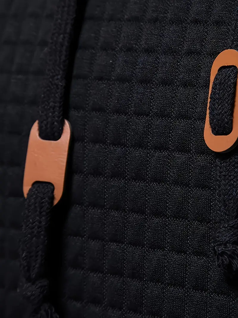 "Herrhoodie med våffelmönster i mjuk tygblandning, perfekt för både avslappnade och formella tillfällen."