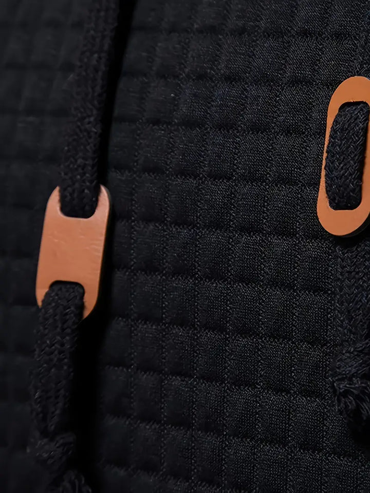 "Herrhoodie med våffelmönster i mjuk tygblandning, perfekt för både avslappnade och formella tillfällen."