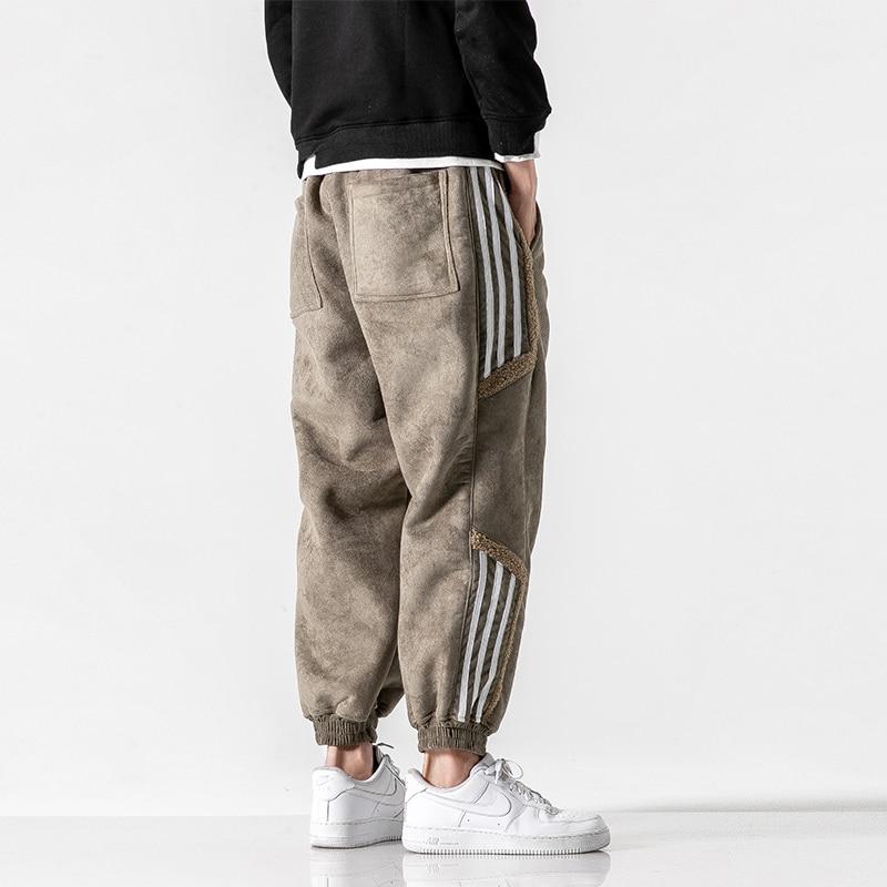 "Herrjoggers i bomull med sidosträckning, trendig stil och elastisk midja för sport och fritid."