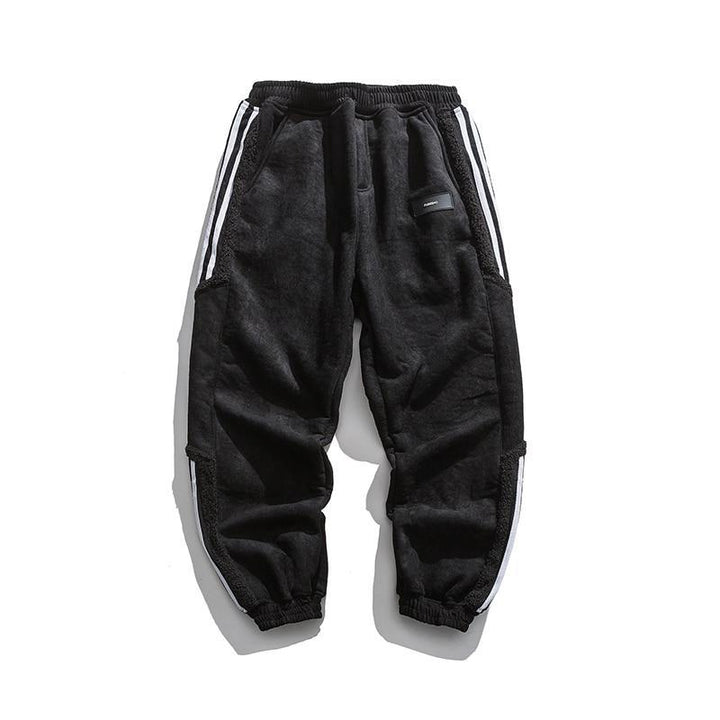"Herrjoggers i bomull med sidosträckning, trendig stil och elastisk midja för sport och fritid."