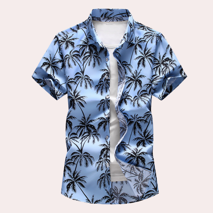 "Herrskjorta med blommigt hawaiimönster framifrån, kortärmad och färgsprakande, perfekt för sommarens avslappnade tillfällen.