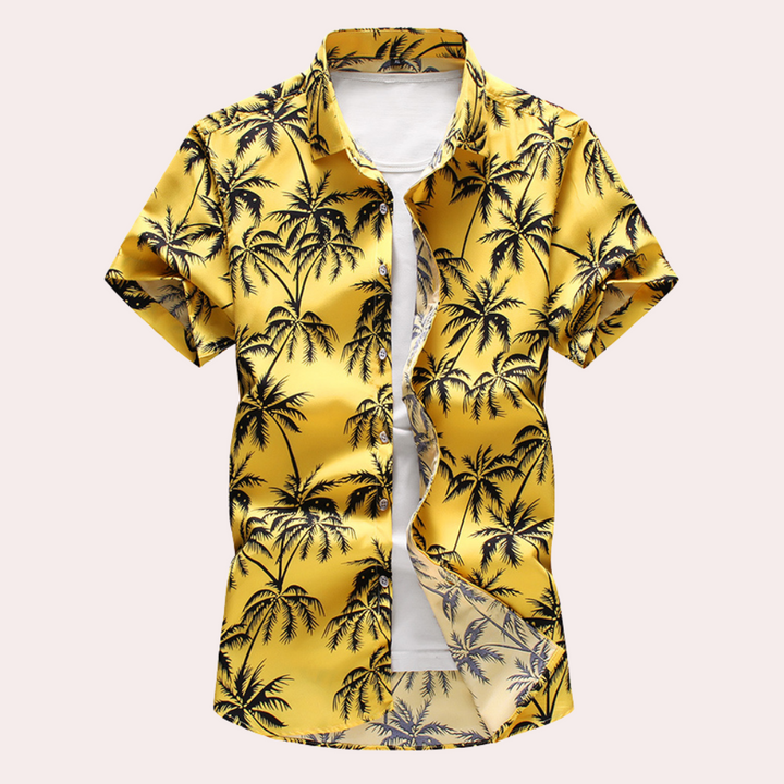 "Herrskjorta med blommigt hawaiimönster framifrån, kortärmad och färgsprakande, perfekt för sommarens avslappnade tillfällen.