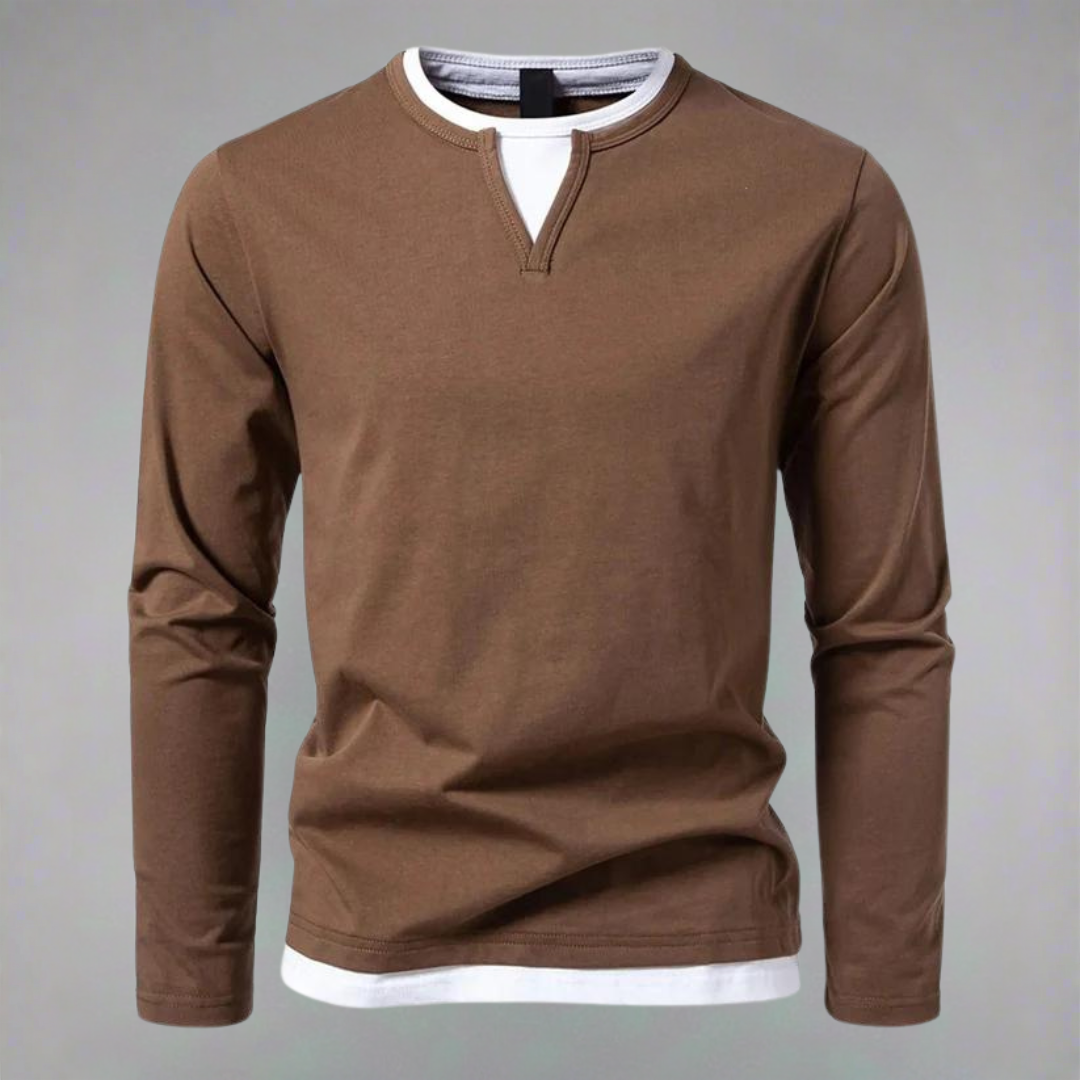 "Herrskjorta med lång ärmar och kontrasterande halsringning, bilden visar skjortans frontvy i en elegant stil."