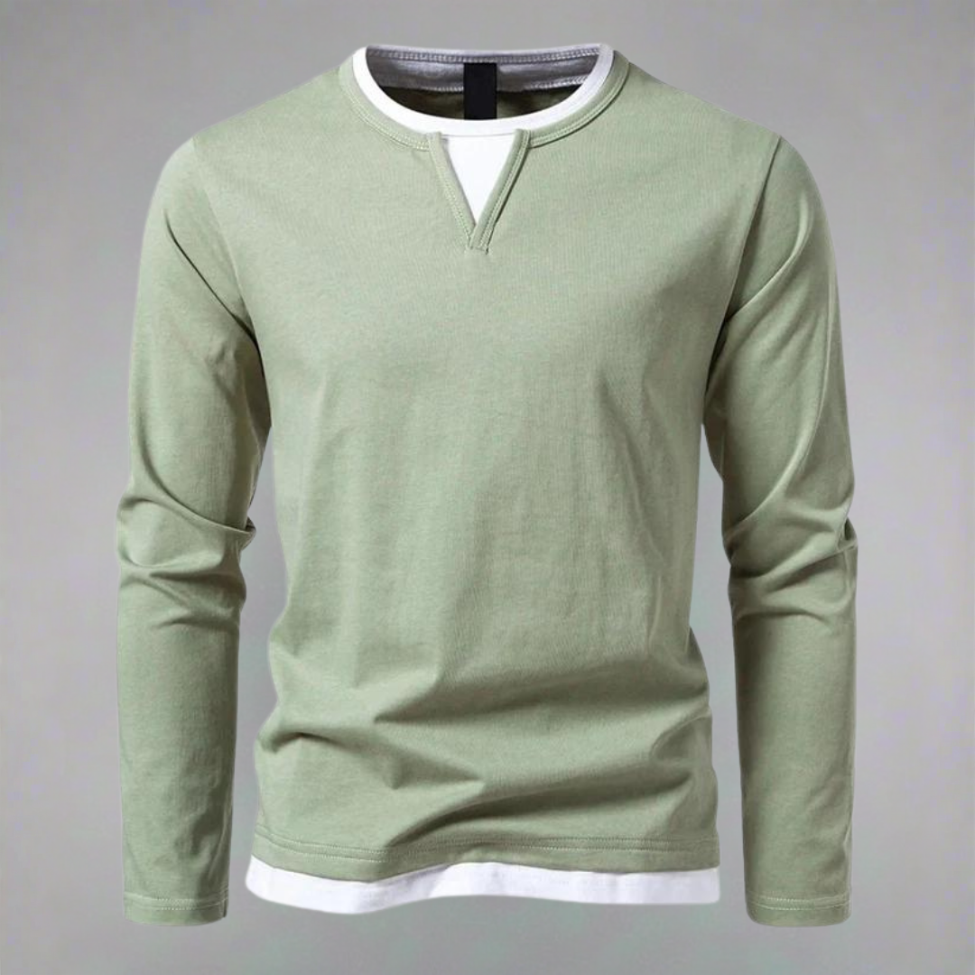 "Herrskjorta med lång ärmar och kontrasterande halsringning, bilden visar skjortans frontvy i en elegant stil."