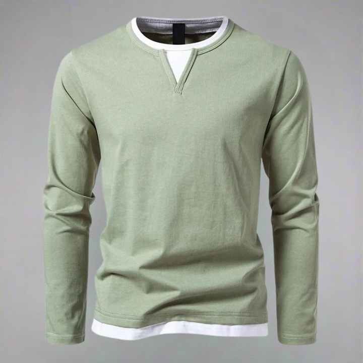 "Herrskjorta med lång ärmar och kontrasterande halsringning, bilden visar skjortans frontvy i en elegant stil."