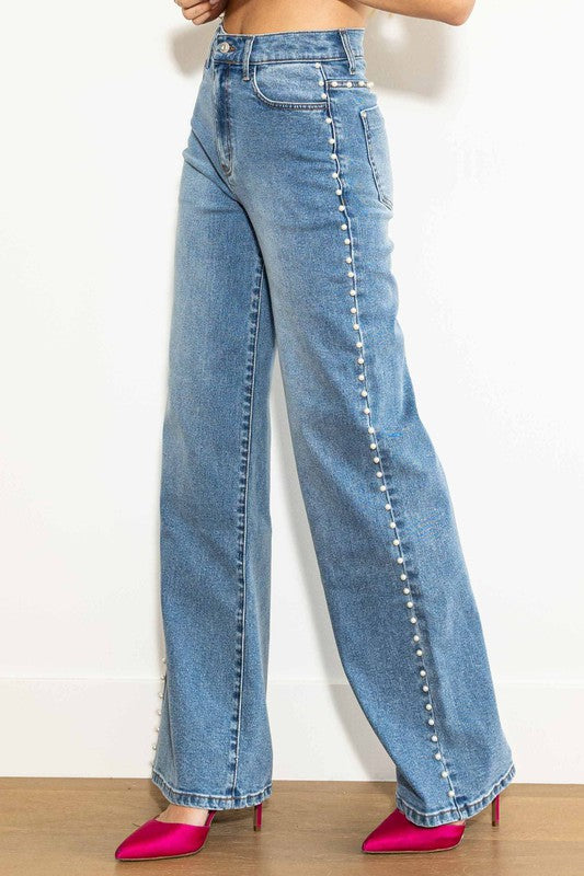 "Höga vida damjeans i medium stone med elegant silhuett och avslappnad look, perfekt för alla tillfällen."