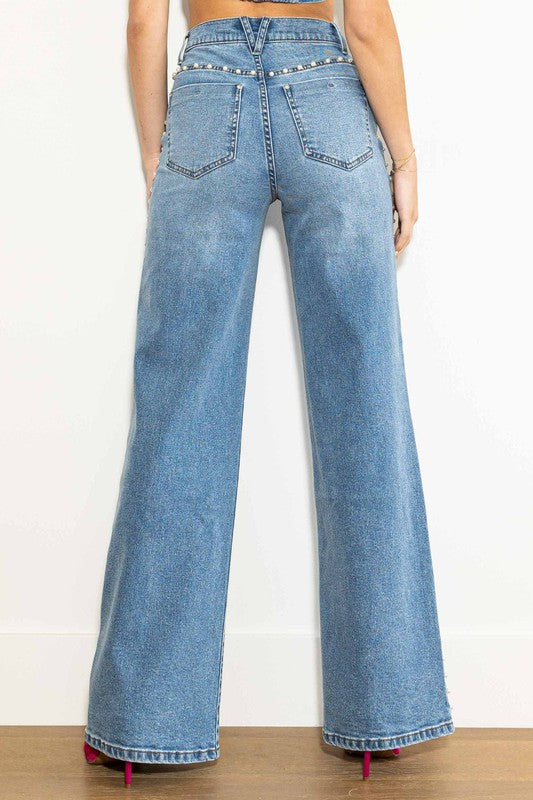 "Höga vida damjeans i medium stone med elegant silhuett och avslappnad look, perfekt för alla tillfällen."