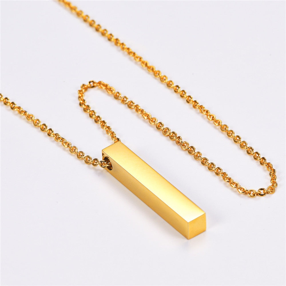 "Hängsmycke kub bar halsband i rostfritt stål, modern och stilfull design, svart, guld eller silver, unisex accessoar."