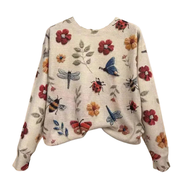 Kabelstickad damtröja med trendiga detaljer, elegant design, i ljusgrå färg, perfekt för casual och formella tillfällen.