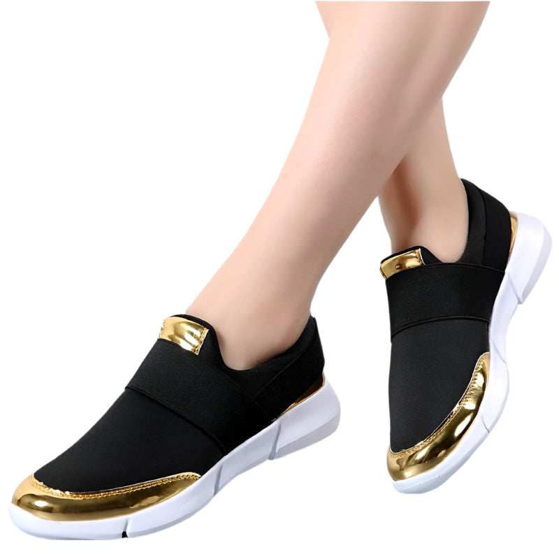 "Kvinnors andningsbara grå och svarta slip-on skor med modern design och stretchmaterial för bekväm daglig användning."