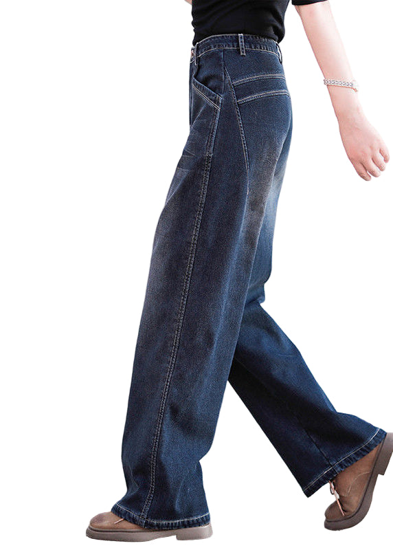 Kvinnors baggy denim byxor med hög midja, rak silhuett, och fickor för chic och modern look. Perfekta för sommarens stilar.