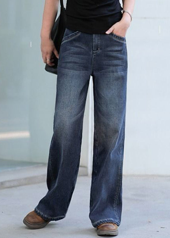 Kvinnors baggy denim byxor med hög midja, rak silhuett, och fickor för chic och modern look. Perfekta för sommarens stilar.