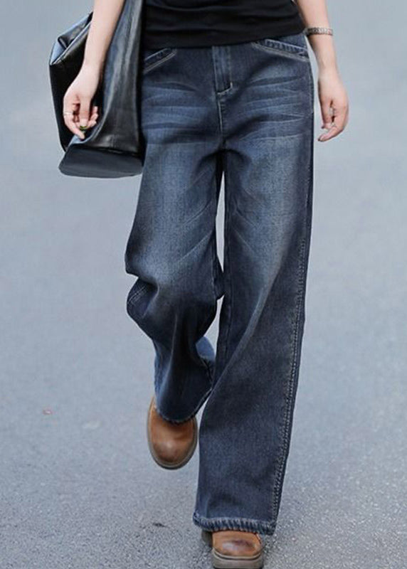 Kvinnors baggy denim byxor med hög midja, rak silhuett, och fickor för chic och modern look. Perfekta för sommarens stilar.