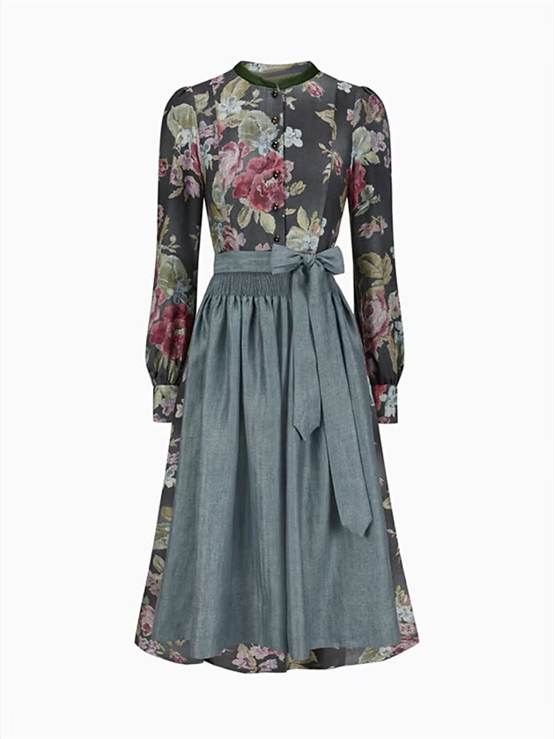 "Kvinnors blommig dirndlklänning med schürze i retrostil, blommönster och traditionell design, perfekt för festligheter."