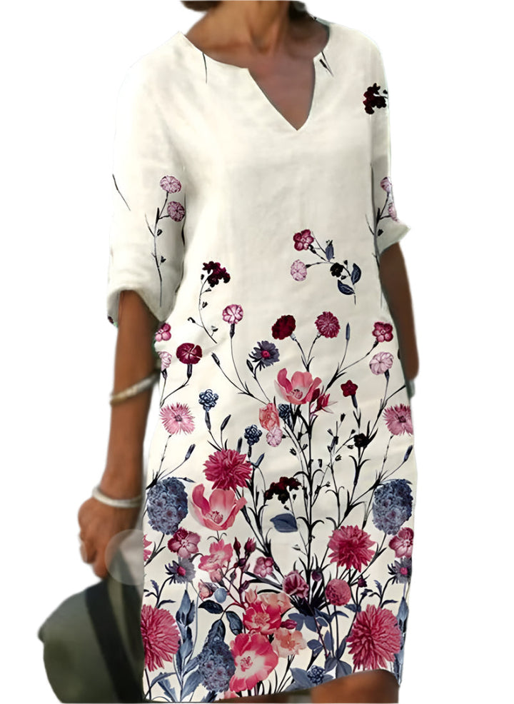 "Kvinnors blommig midi-klänning i mjukt material med elegant design och feminin charm, perfekt för alla tillfällen."