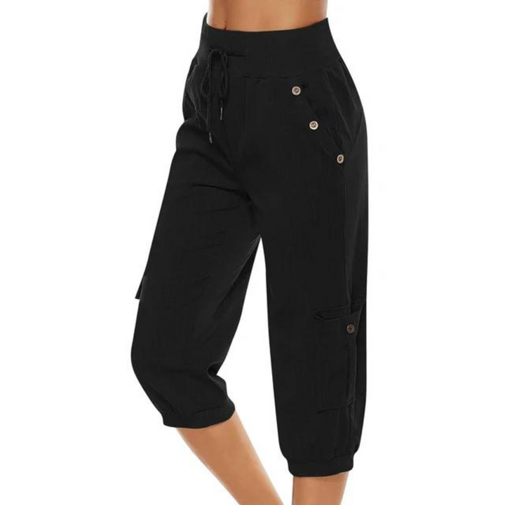 "Kvinnors croppade byxor med elastisk midja, polyester, enfärgade, vadlånga, med fickor och dragsko."