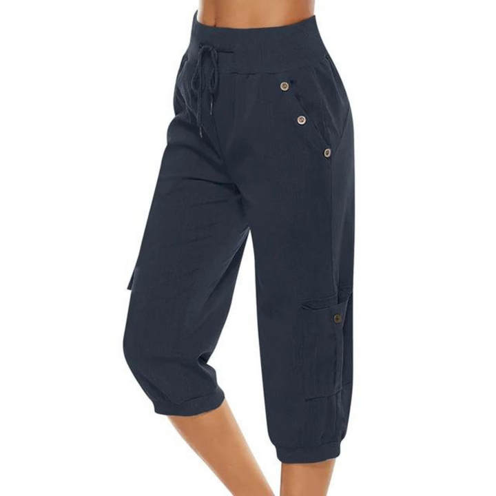 "Kvinnors croppade byxor med elastisk midja, polyester, enfärgade, vadlånga, med fickor och dragsko."