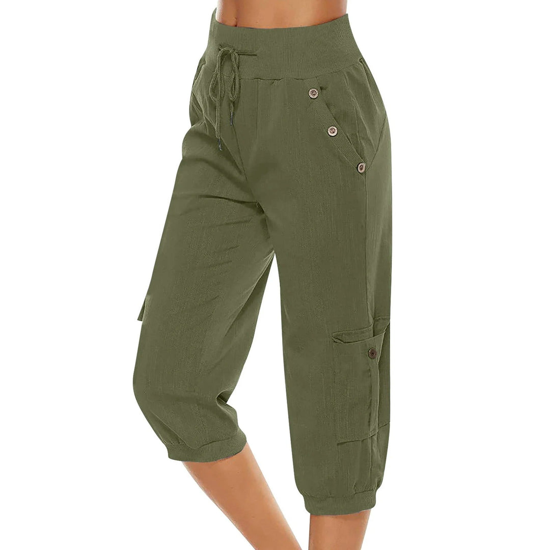 "Kvinnors croppade byxor med elastisk midja, polyester, enfärgade, vadlånga, med fickor och dragsko."