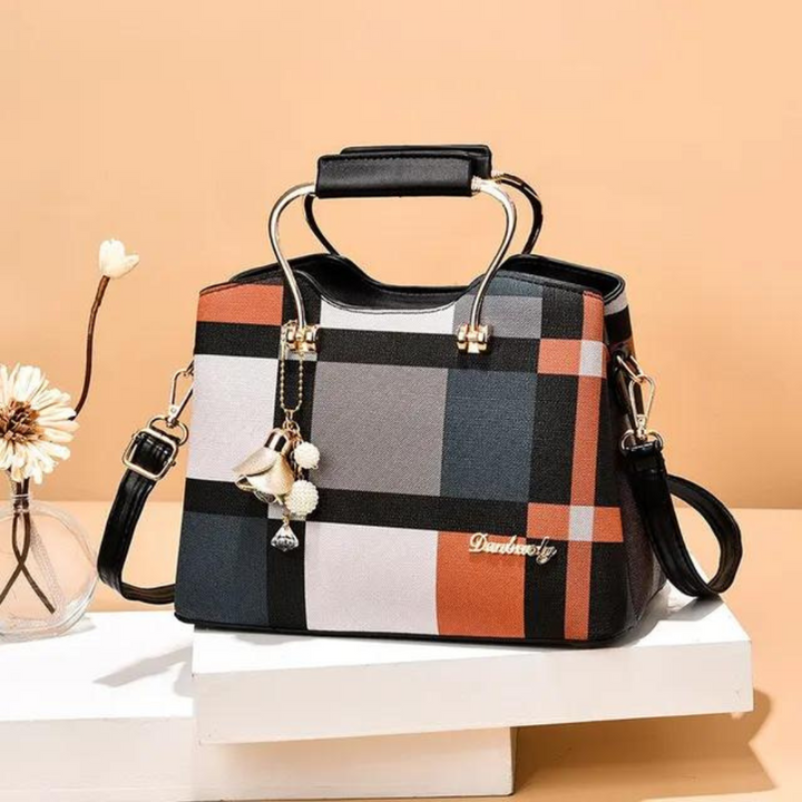 Kvinnors crossbody-väska i rutigt mönster, tillverkad i PU-läder, med justerbar rem och elegant design.